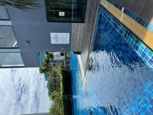 an overhead view of a swimming pool in a building at Sea View Room - Infinity Pool near Terminal 21 in Pattaya +9 photos