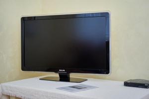 a computer monitor sitting on top of a table at Villa California in Tivat