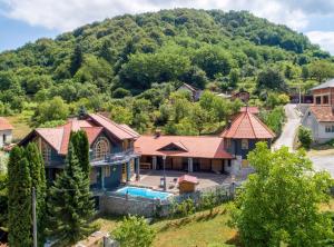 an aerial view of a house with a mountain in the background at Requiem Rustical Heaven Villa with Outdoor Pool in Varaždin