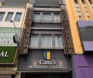 a building with a sign on the side of it at Cana's Boarding Ciledug in Pasarjumahat-Kulon