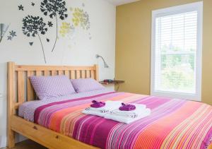 מיטה או מיטות בחדר ב-Pioneer Inns