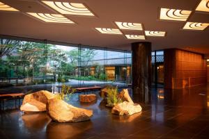 a lobby with large rocks on the floor at Gajoen Tokyo in Tokyo