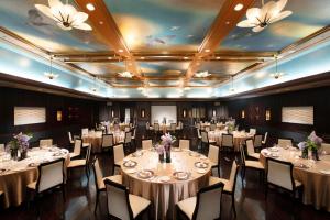 a banquet hall with tables and chairs in a room at Gajoen Tokyo in Tokyo +102 photos