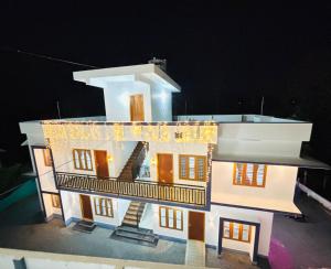a model of a house at night at Zak Holidays Wayanad in Wayanad