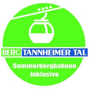 Una señal verde con una tetera. en Apart & Pension Wassermann inklusive Sommerbergbahnticket en Tannheim