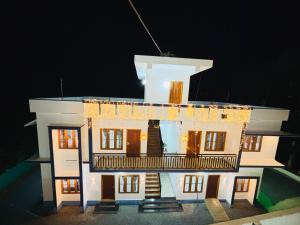 a lego model of a house at night at Zak Holidays Wayanad in Wayanad