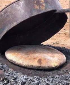 a bagel is cooking on a grill at Bhbs accommodatie Maroc2 in Tazzarine +15 photos