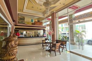 a dining room with a table and chairs in a store at Hotel Uno in Davao City +140 photos