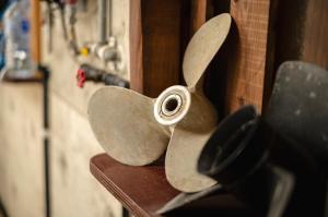 a pair of scissors hanging on a wall at 海の家 in Kumejima