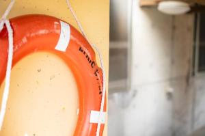 an orange object is hanging on a wall at 海の家 in Kumejima