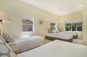 a living room with two beds and a couch at Alderly Terrace in Noosa Heads