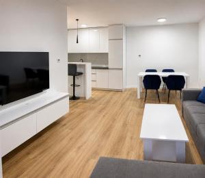 a living room with a couch and a table at Central Аpartment Foca with garage in Foča +22 photos