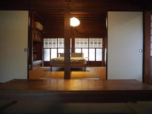 a bedroom with a bed in a room at うみうたう in Yuwan