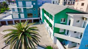 an aerial view of a building and a palm tree at Loewenhoff Seaview Suite 2 in Swakopmund