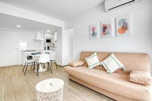a living room with a couch and a table at Bonaire in Gandía