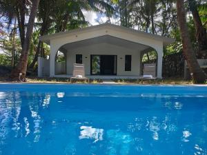 a house with a swimming pool and trees at Isola Riambel in Riambel