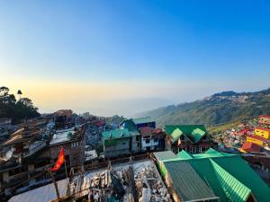 an overhead view of a city with buildings at Hotel Pinecrest Inn Darjeeling With Mountain View Room And Parking - Restaurant Facility in Darjeeling