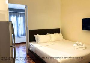 a bedroom with a bed with two shoes on it at Heritage Collection on Boon Tat in Singapore +1 photo