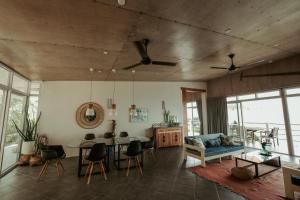 a living room with a couch and a table at Balay Kalachuchi in Barili