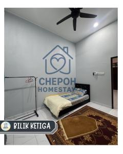 a bedroom with a bed with a sign on the wall at Chepoh Homestay Pasir Mas in Pasir Mas