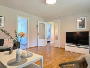 a living room with a large flat screen tv at Villa Edda in Vidsel