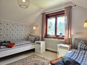 a bedroom with two beds and a window at Hus Norrbotten in Vidsel