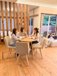 a group of women sitting around a table in a room at Moro伊豆の国 in Izunokuni