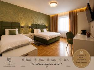 Un pat sau paturi într-o cameră la Boutique Central
