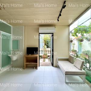a living room with the names of the rooms at Mai Home in Ấp An Mỹ