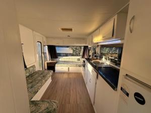 a kitchen and living room of an rv at Henarata Homestead in Wakefield