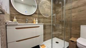 a bathroom with a sink and a shower at L'Appart' in Bruz +16 photos