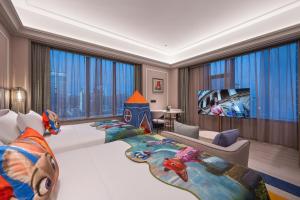 a bedroom with a large bed and a large window at Mercure Kunming Wujiaba in Kunming
