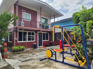 a playground in front of a house at Sabai - Sabai in Bangkok