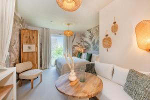 a living room with a bed and a table at BALI BLIZZ - App 11 in Benz