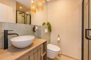 a bathroom with a sink and a toilet at BALI BLIZZ - App 12 in Benz +15 photos