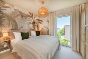 a bedroom with a large bed and a large window at BALI BLIZZ - App 14 in Benz +17 photos