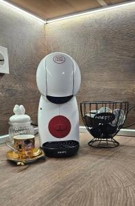 a coffee maker sitting on top of a counter at Студио МИНЕРА in Kyustendil +11 photos