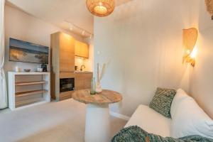 a living room with a couch and a table at BALI BLIZZ - App 16 in Benz +14 photos