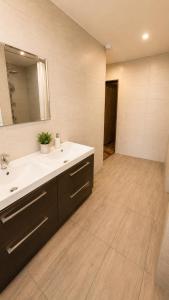 a bathroom with a sink and a mirror at Pokoje Bielsko in Bielsko-Biała