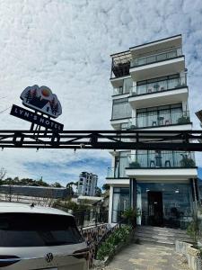 a white car parked in front of a building at Lyn's Hotel Da Lat in Da Lat +58 photos