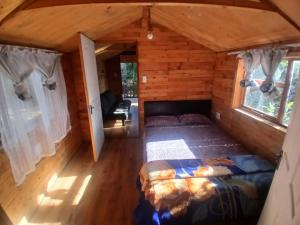 an overhead view of a bedroom in a log cabin at Diamond Vault Rustic Mountain Cabins in Hogsback