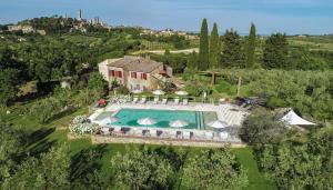 an aerial view of a house with a swimming pool at Podere Bellavista in San Gimignano