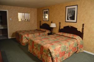 Ein Bett oder Betten in einem Zimmer der Unterkunft Cedar Lodge