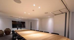 a conference room with a large wooden table and chairs at Hôtel WELLNESS EAU DE ROCHE Durbuy in Durbuy +69 photos