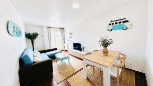 a living room with a couch and a table at Ocean Suances in Suances