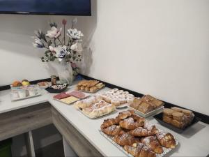 a table with different types of pastries on it at Oasi nel Deserto in Custonaci