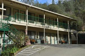 a building with green balconies on the side of it at Cedar Lodge in El Portal