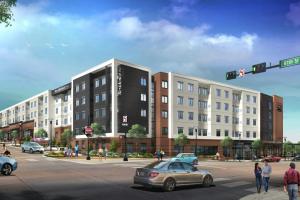 an architectural rendering of a building on a street corner at Residence Inn by Marriott Lenexa City Center in Lenexa