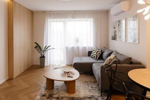a living room with a couch and a table at AN apartment 5 in Rēzekne