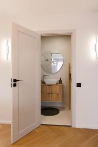 a bathroom with a sink and a mirror at AN apartment 5 in Rēzekne